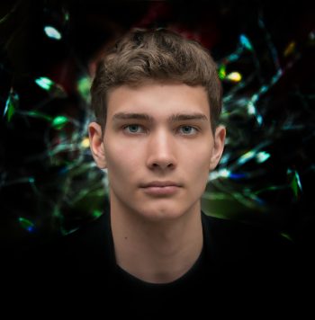 Portrait of a young man on a black background